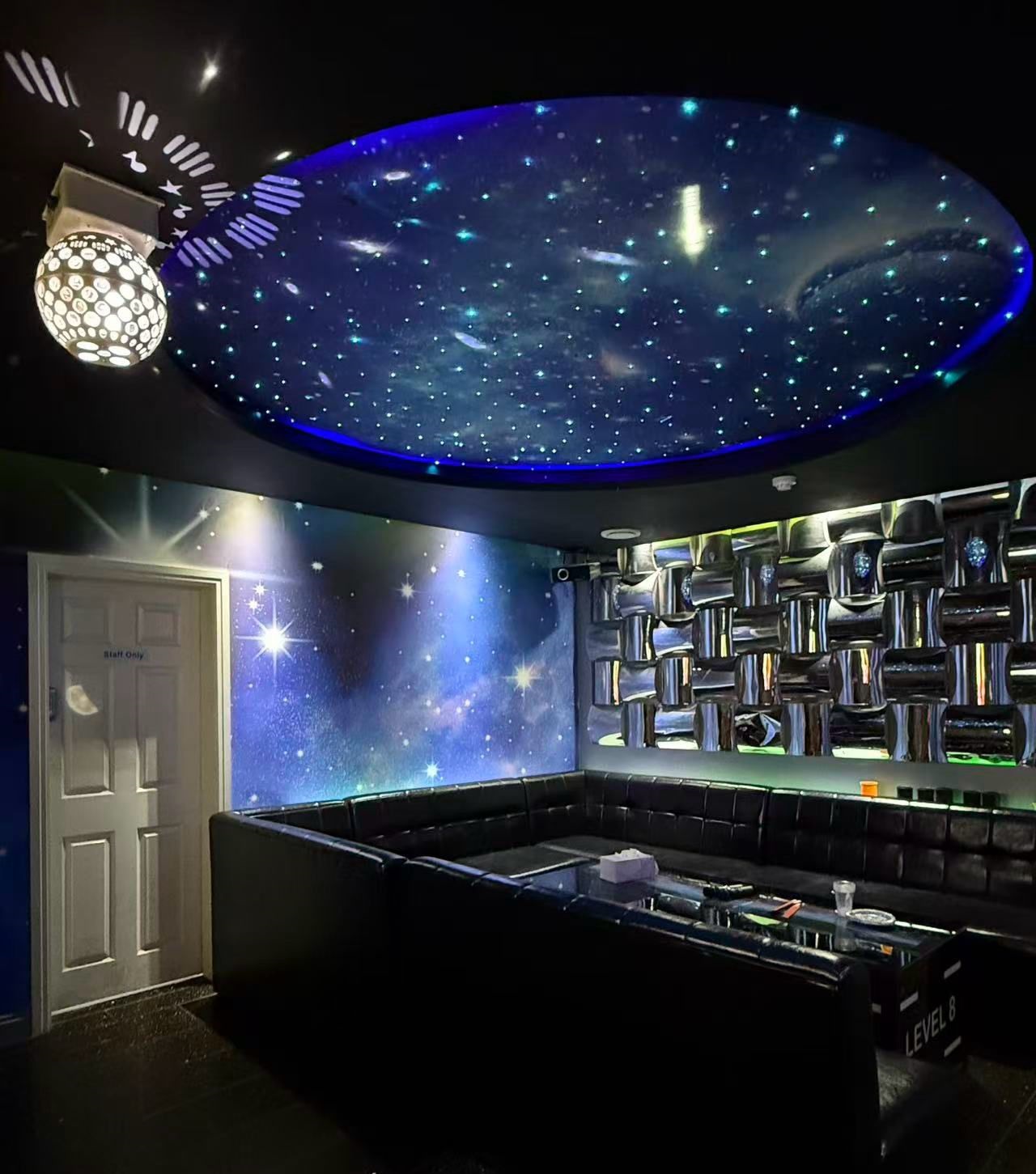 Neon-lit private karaoke room at Level 8 KTV